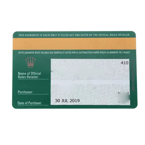 Rolex warranty card of a pre-owned Datejust with personal details blurred