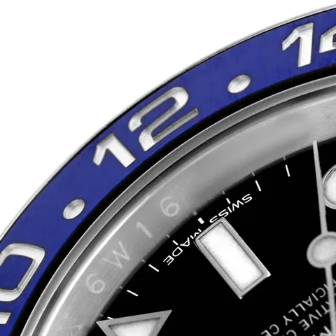 Macro view of a blue and black ceramic GMT bezel insert